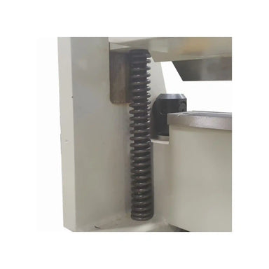 A close up image of the spring assist on the Baileigh BB-5016F-DS