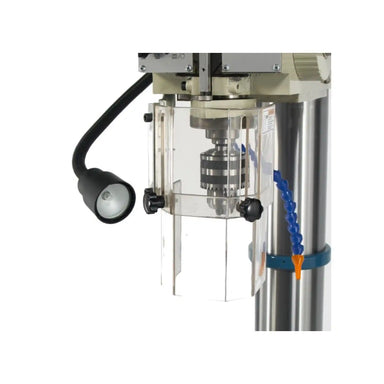 A close up image of the work light and chuck installed on the Baileigh DP-1500G