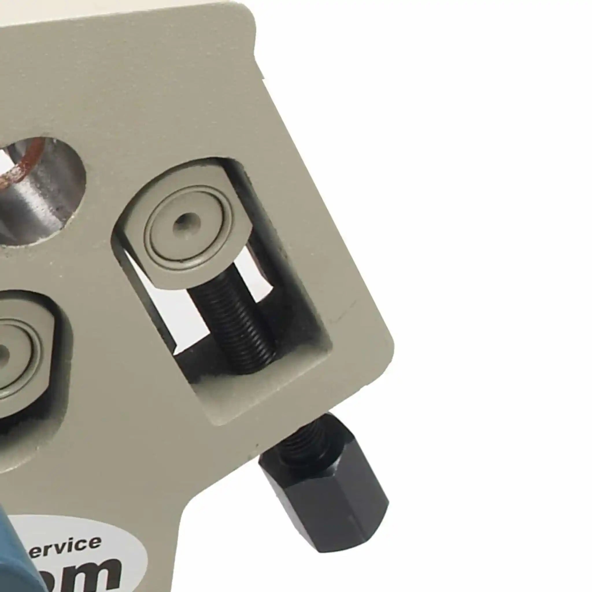 A close up image taken of the roller adjustment mechanism installed on the Baileigh SR-5016M