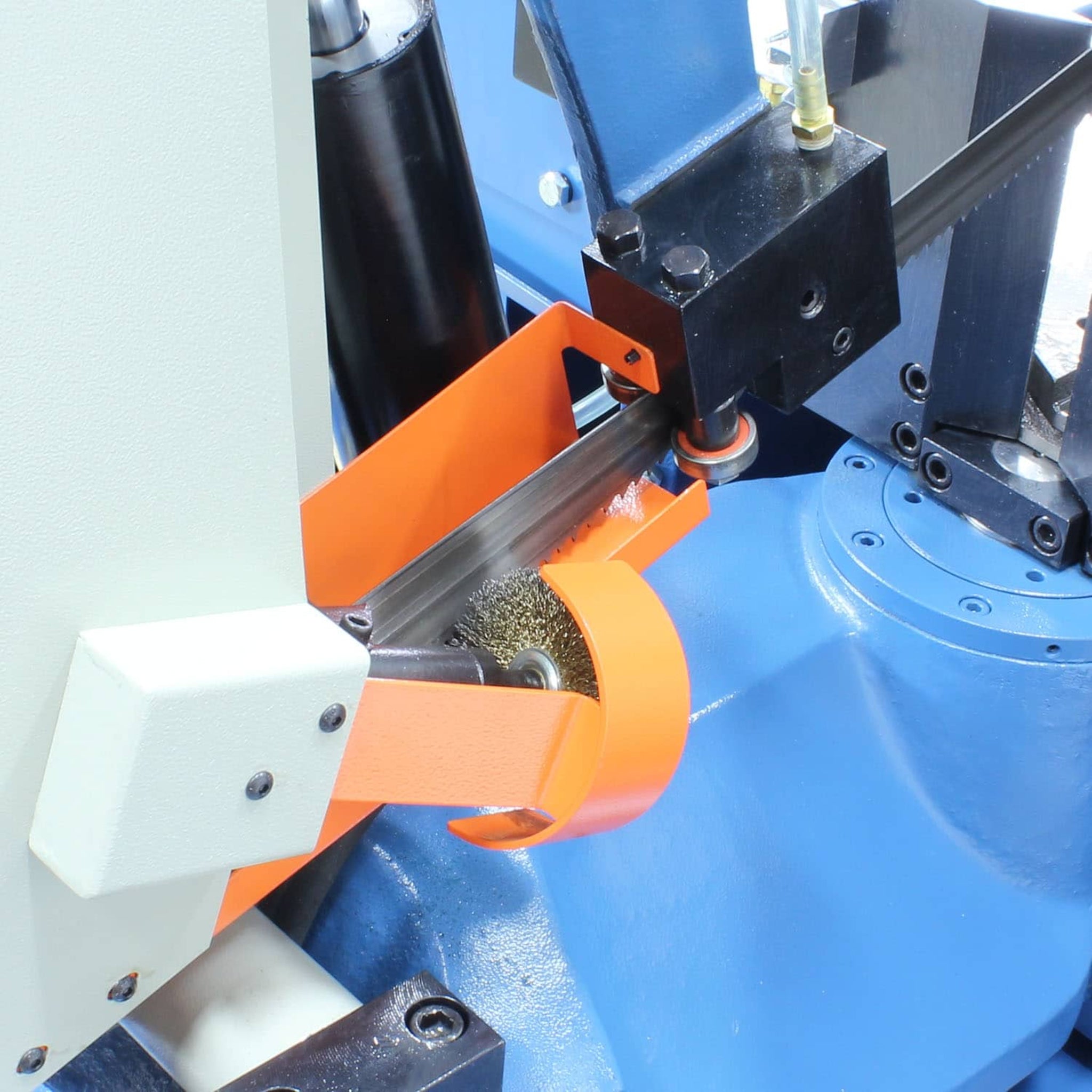 A close up image of the horizontal bandsaws blade brush system