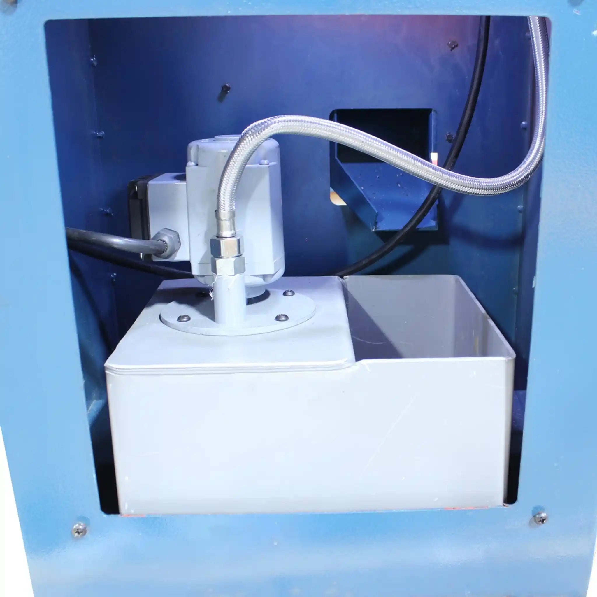 A image of the coolant pump and reservoir on the Baileigh PL-1340E