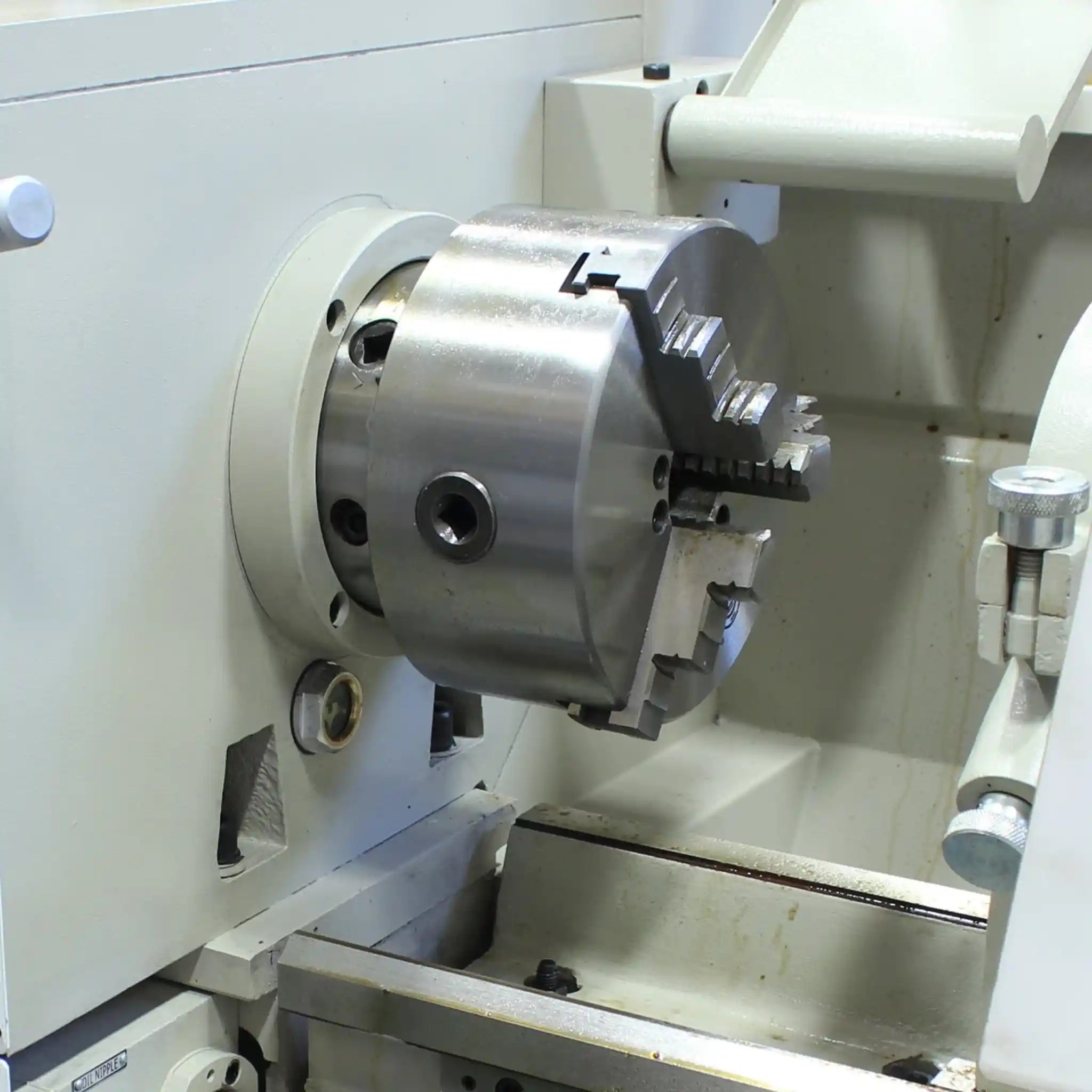 A image of a three jaw chuck installed on the Baileigh PL-1236E-DRO lathe