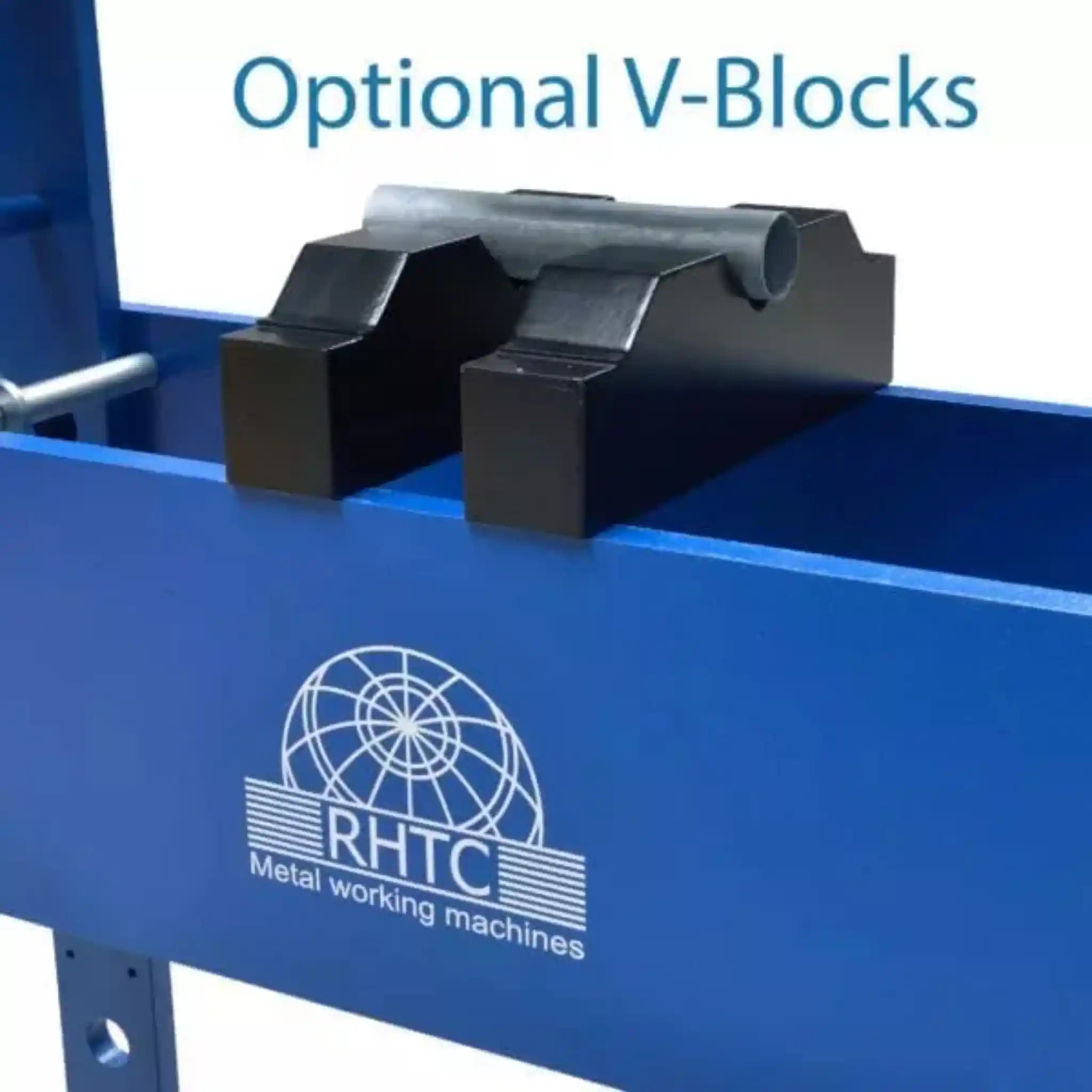 A image of the optional v blocks holding a piece of tubing. The machine is manufactured by RHTC